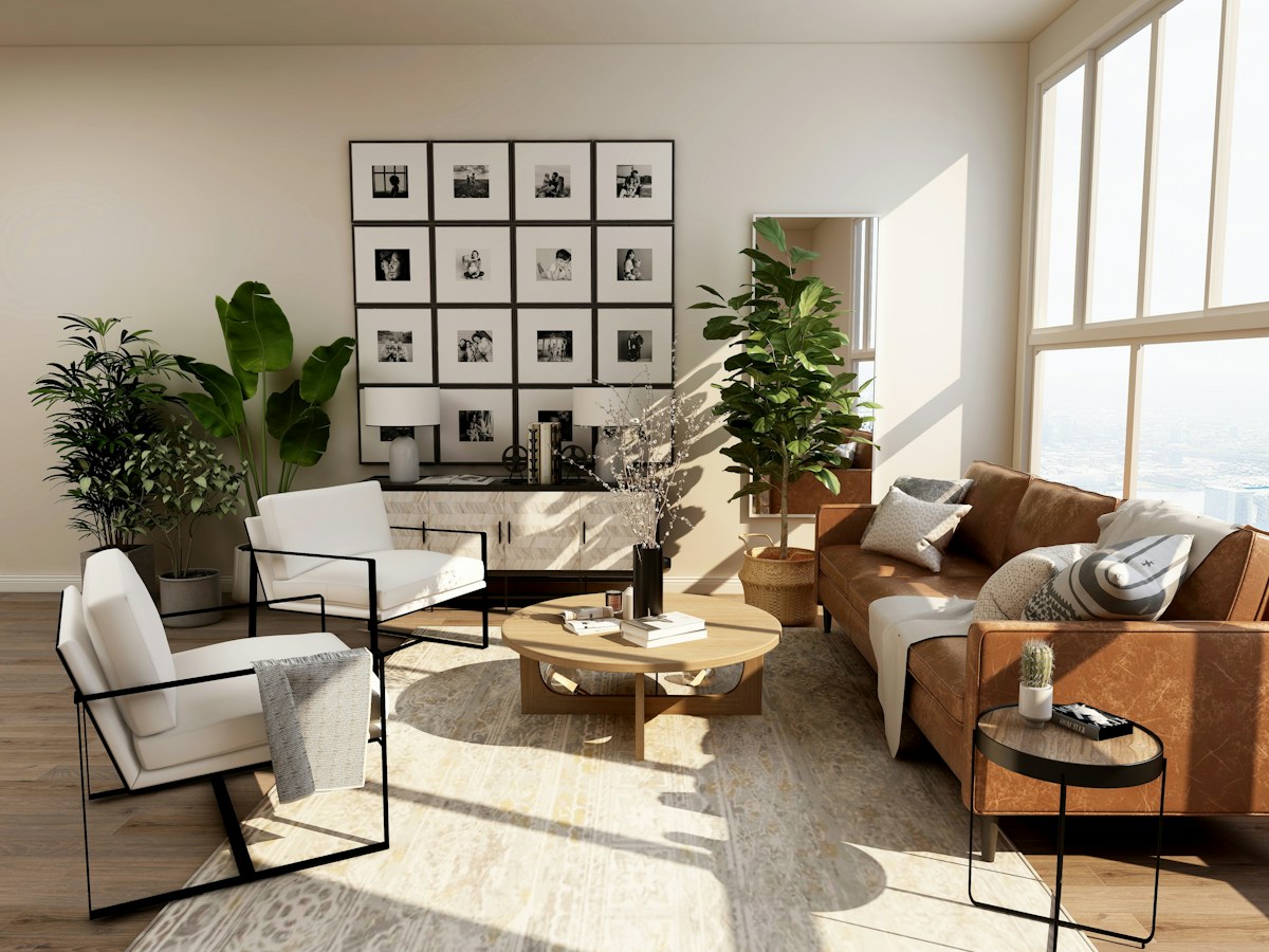 Sunlit residential interior with plants, artwork and comfortable seating